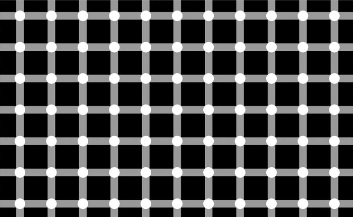 A black background with a white grid on it, where dark spots seem to appear and disappear very quickly at the intersections