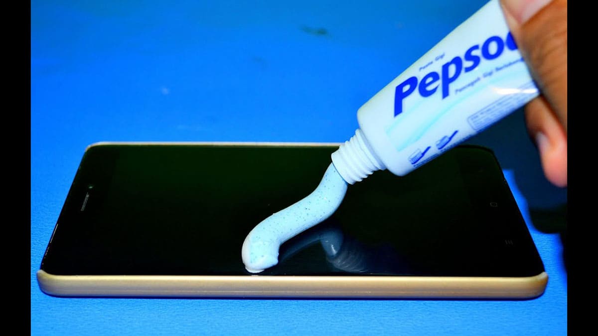  Applying toothpaste on phone screen 