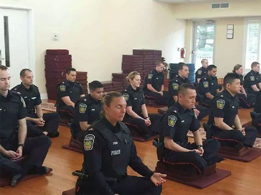A group of cops meditating 