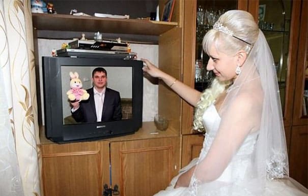 bride looking at groom in the TV set 