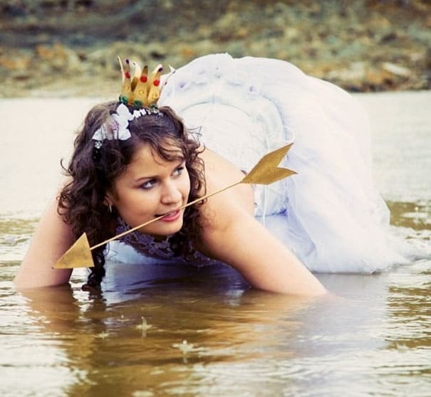 bride in the water with an arrow in her mouth 