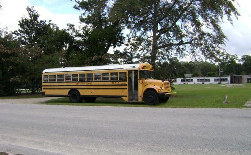 A school bus in front of the school