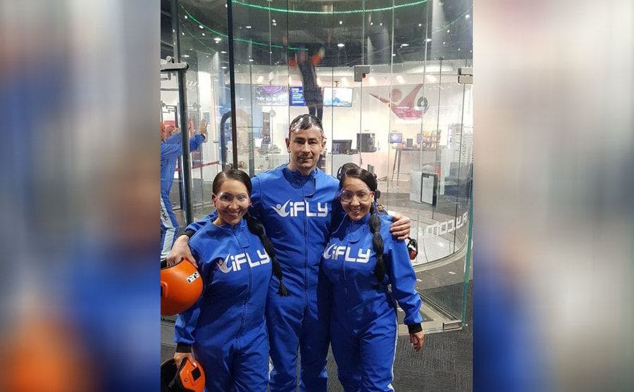 Lucy, Anna, and Ben at an indoor skydiving place 
