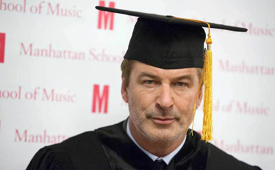 Alec Baldwin wearing his graduation cap and gown after receiving his Doctor of Musical Arts degree in 2012