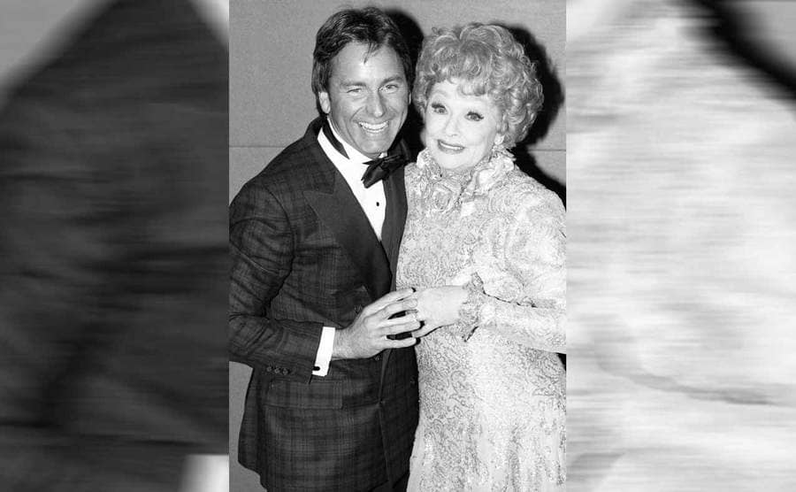 John Ritter and Lucille Ball posing together at an awards event 