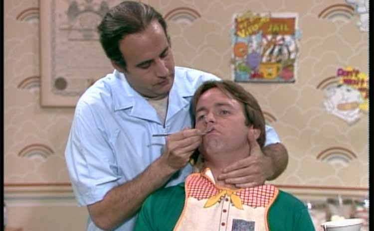 Jeffrey Tambor as the dentist taking a look at John Ritter’s teeth in an episode of Three’s Company 