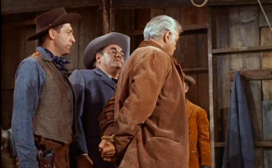 Lorne Greene with his hands tied behind his back in a scene from Bonanza 