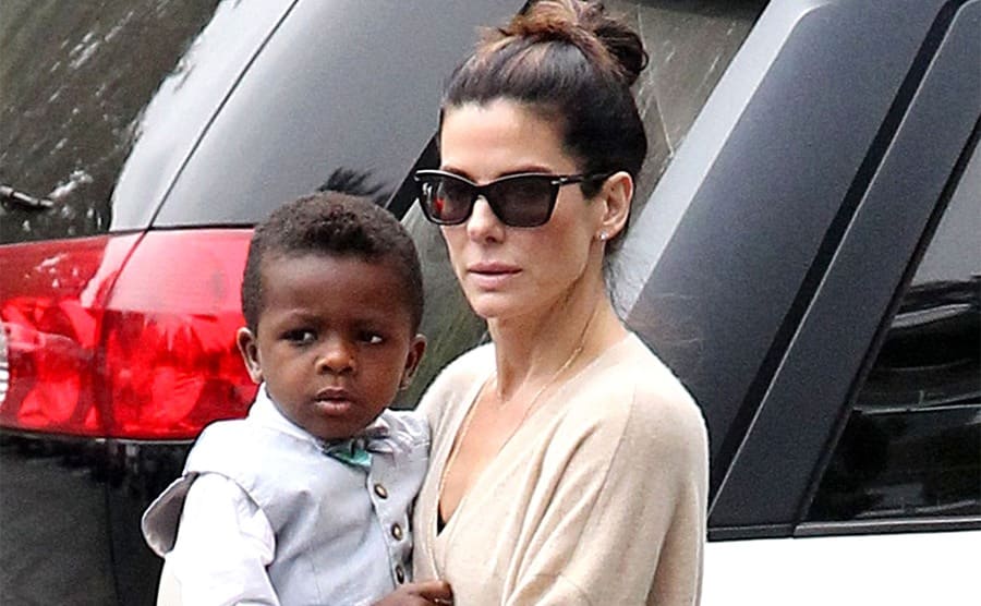 Sandra Bullock carrying her son Louis around while they are out and about in LA 