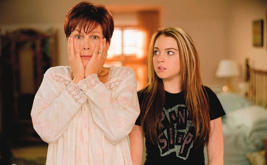 Jamie Lee Curtis looking shocked with Lindsay Lohan standing next to her 