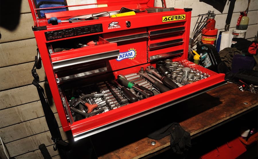 A toolbox with opened drawers and a lock 