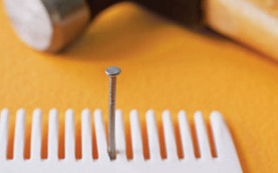 Using a fine-tooth comb to hold a nail