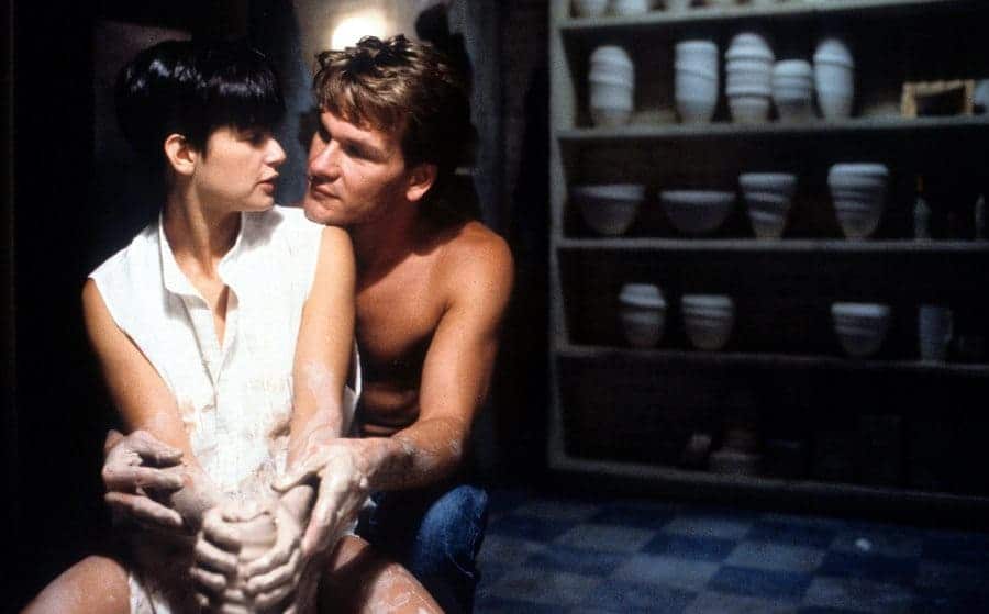 Demi Moore and Patrick Swayze in a scene from the film Ghost doing pottery together 