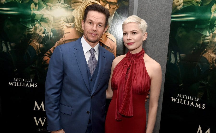 Mark Wahlberg and Michelle Williamson the red carpet posing for a photograph 