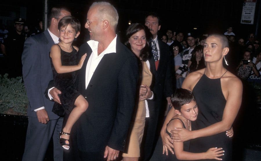 Demi and Bruce on the red carpet with two of their daughters in 1996