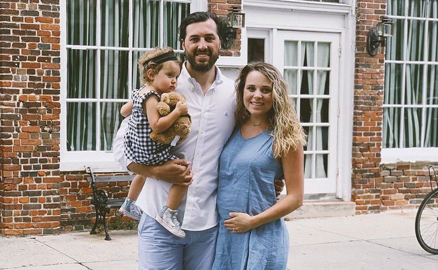 A pregnant Jinger Duggar and husband Jeremy and their first child. 