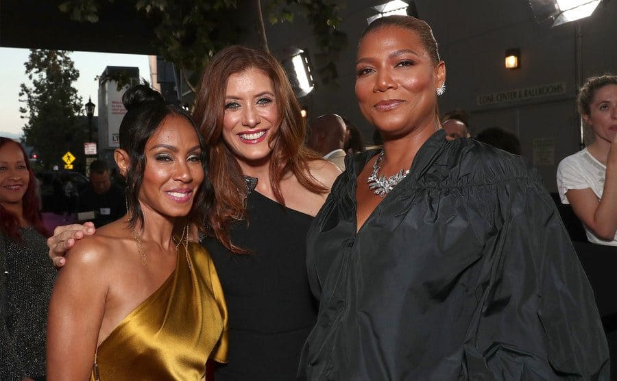 Jada Pinkett Smith, Kate Walsh, and Queen Latifah posing together on the red carpet at the Girls Trip premiere 