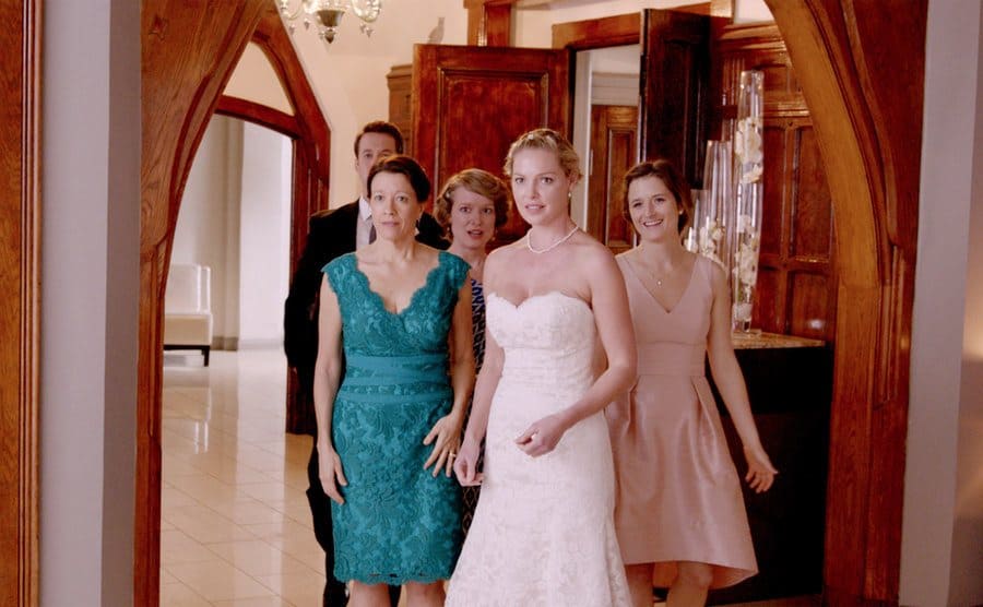 Katherine Heigl in a wedding gown with her on screen family in Jenny’s Wedding 