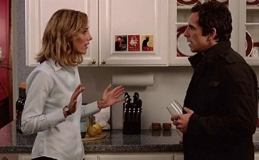 kim Raver and Ben Stiller standing in a fancy kitchen having a discussion 