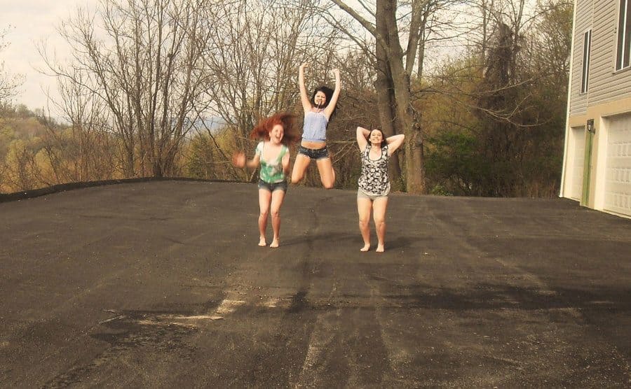 Shelia, Skylar, and Rachel jumping up in the air 