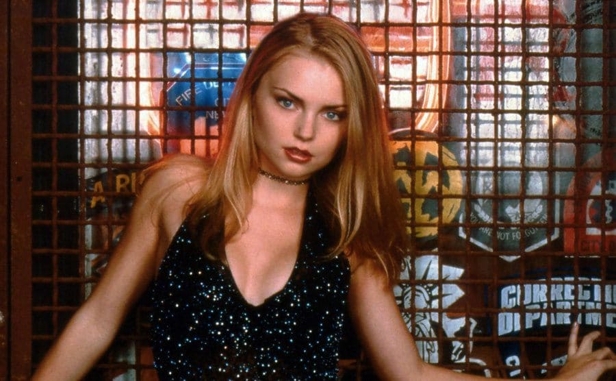 Izabella Miko posing in front of a window with a grate over it for a Coyote Ugly promotional photograph 