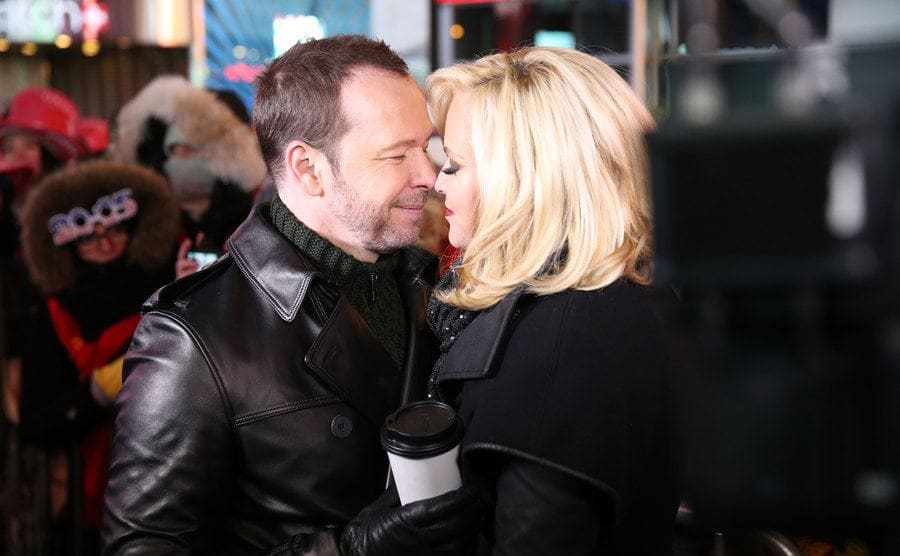 Donnie and Jenny about to kiss looking very in love in Times Square