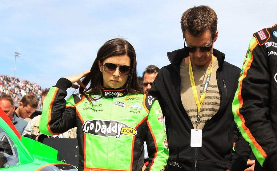 Danica Patrick and Paul walking on the racetrack 