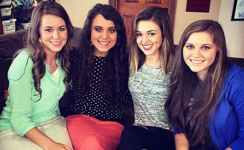 Sadie is sitting on the couch with a few of the Duggar girls. 
