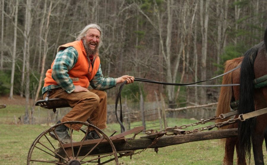 Eustace Conway working his land on the back of his horses. He looks pretty happy.