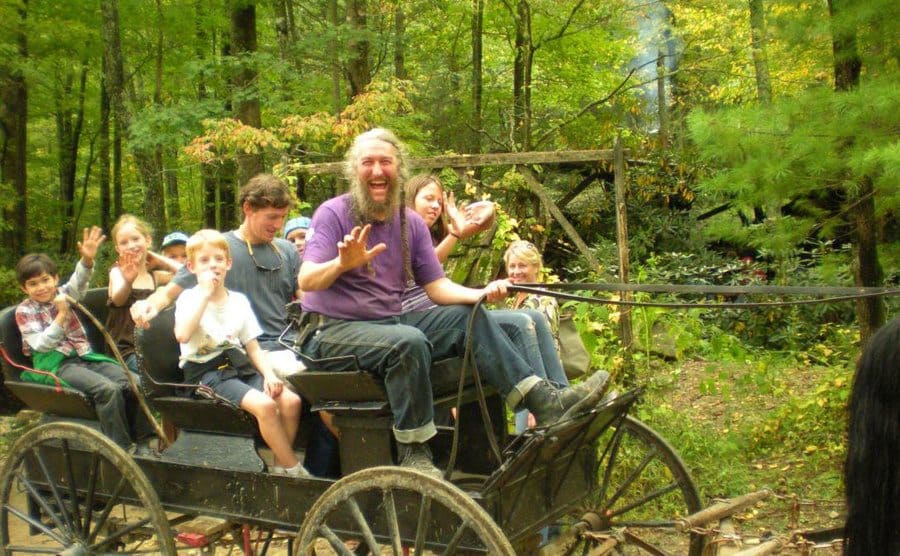 Eustace at work with at least a dozen tourists on his wagon.