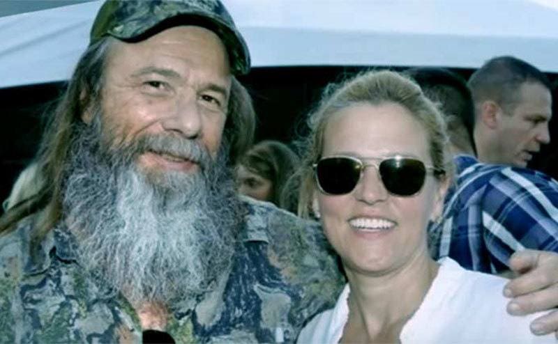 Preston with his arm around his wife, Kathleen.