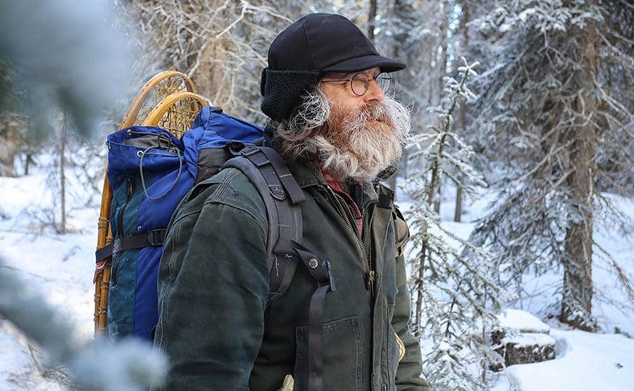 Rich Lewis walking through the snowcovered mountain