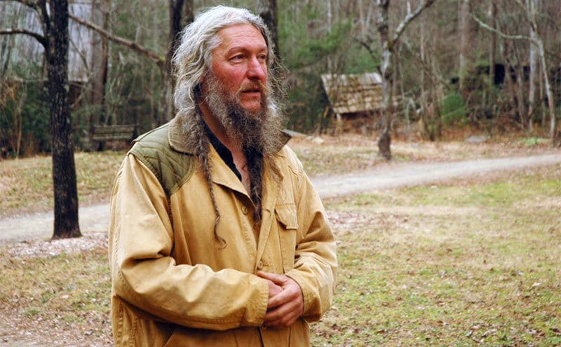 Eustace Conway explaining things about the wildness on his farm.