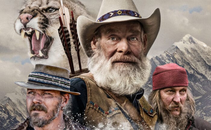 The men of Mountain Men posing in front of mountains