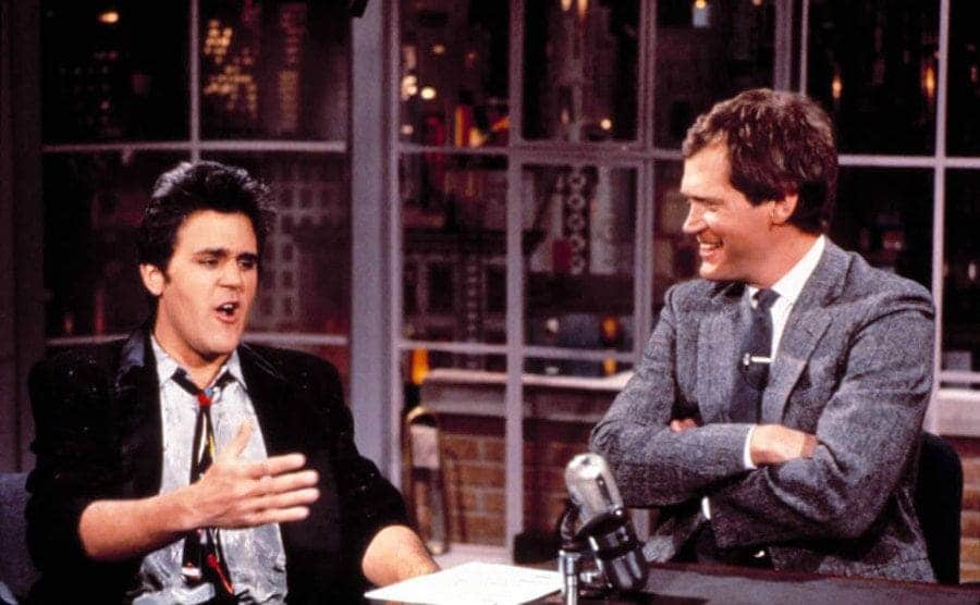 Jay Leno being interviewed by David Letterman on the late-night show 