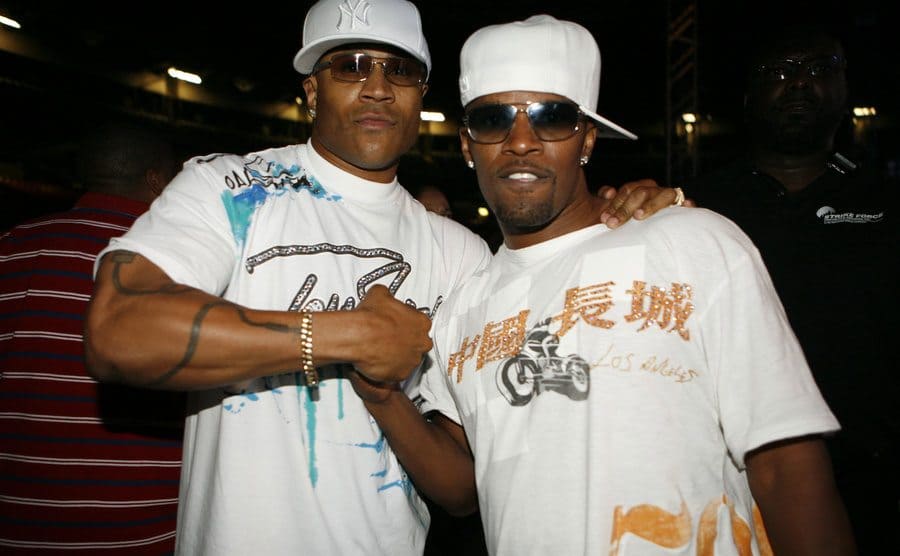 LL Cool J and Jamie Fox posing together in white hats and shirts
