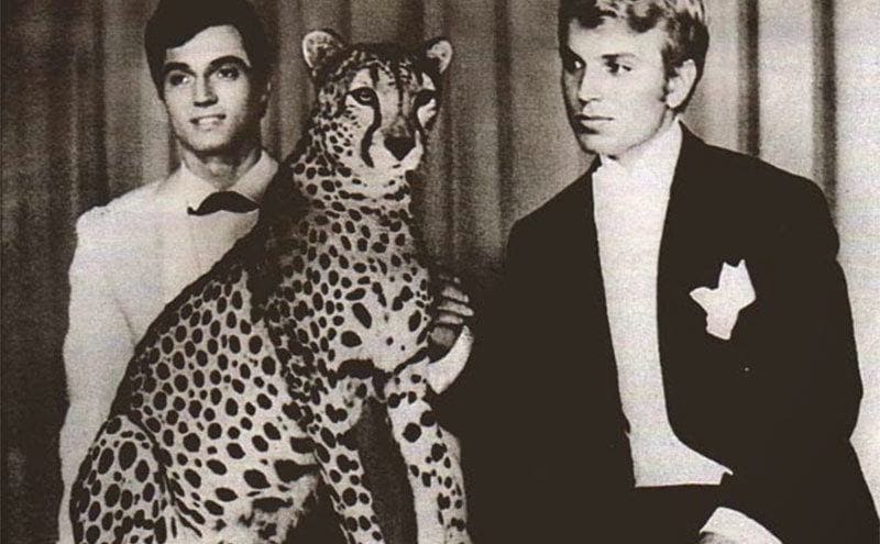 Siegfried and Roy performing with a cheetah on a cruise ship. 