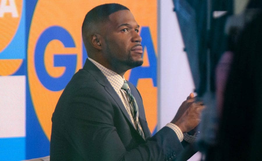 Michael Strahan is sitting on the set of Good Morning America.