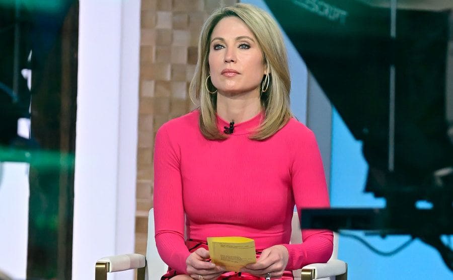 Amy Robach is sitting on the set of Good Morning America.
