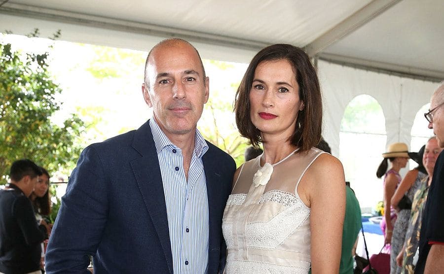 Matt Lauer is standing next to his former wife, Annette Roque. 