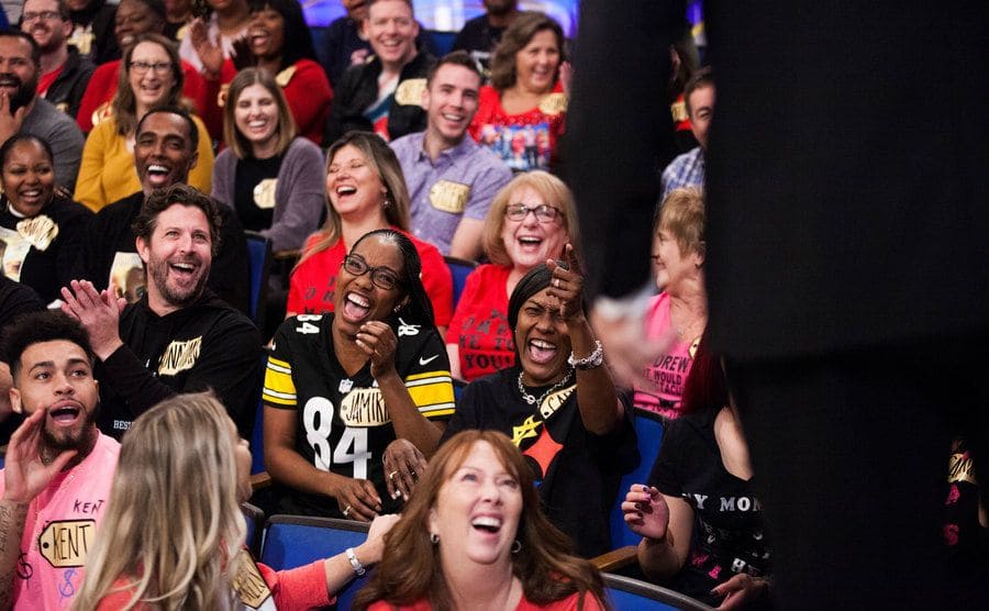 Audience members are laughing while Drew Carey asks questions during a taping of The Price is Right at CBS Television.