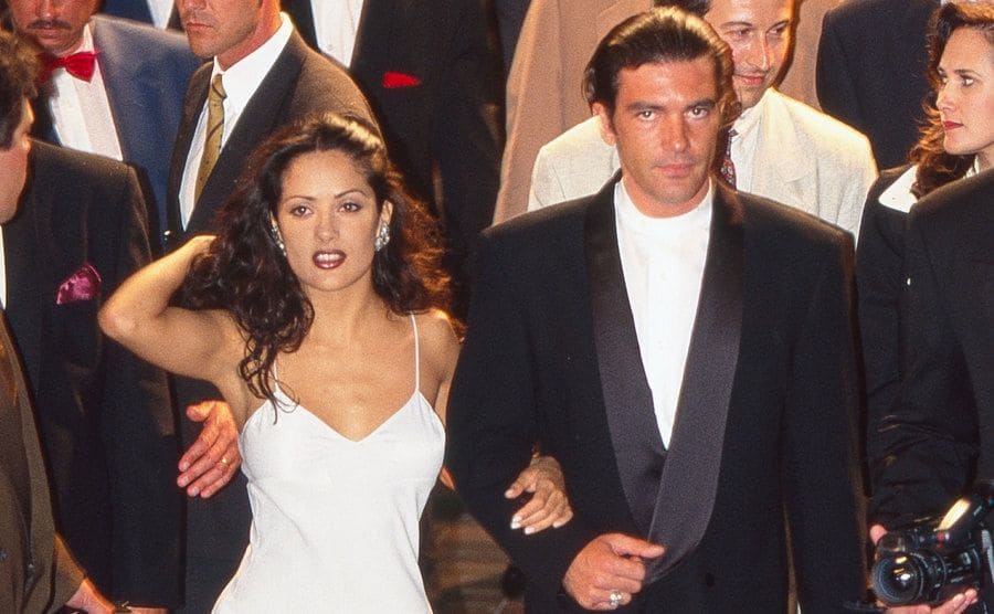 Salma Hayek and Antonio Banderas are walking together amongst the crowd at the Cannes.