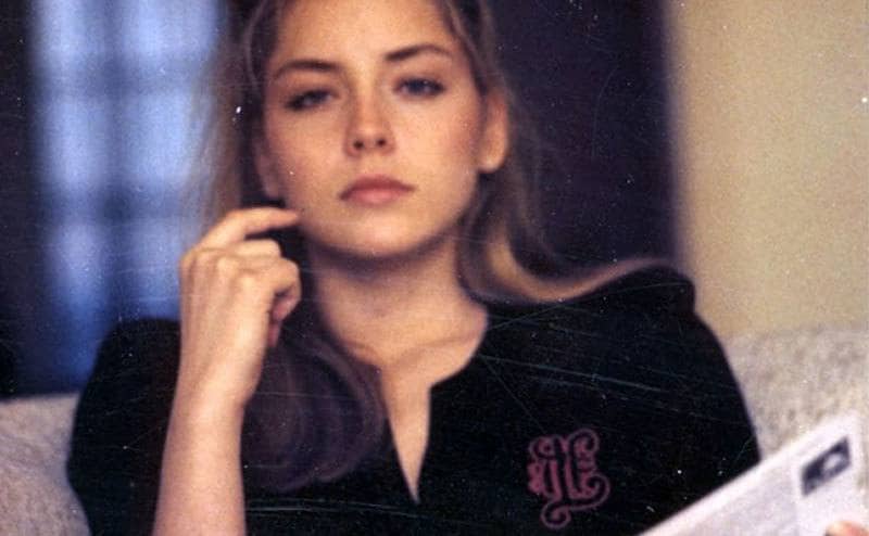 Young Sharon Stone reads a book.