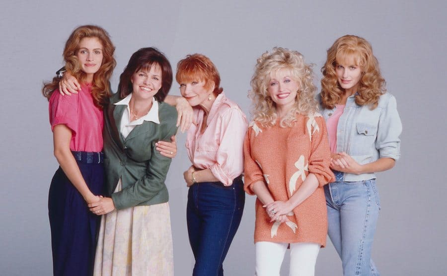 Julia Roberts, Sally Field, Shirley MacClaine, Dolly Parton, and Daryl Hannah pose together. 