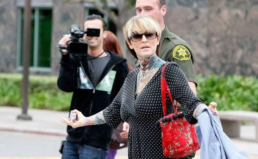 Janine Lindemulder is escorted into a Justice Center by Orange County Sheriff Deputies.
