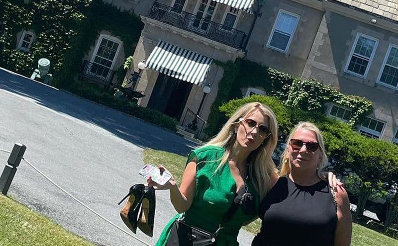 Kylie McCollough and DeJoria's mother pose for a photo outside their house. 