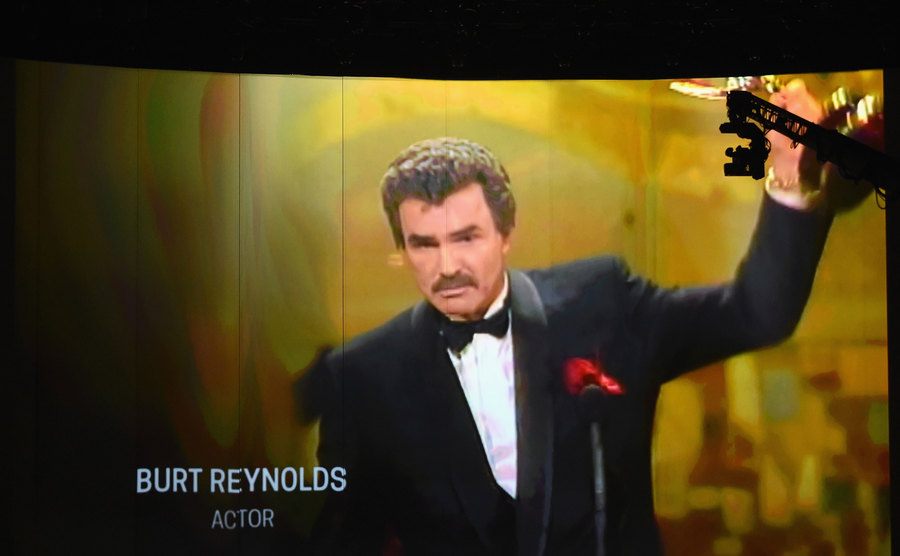 A projection of Burt Reynolds on a video screen in his memorial tribute. 