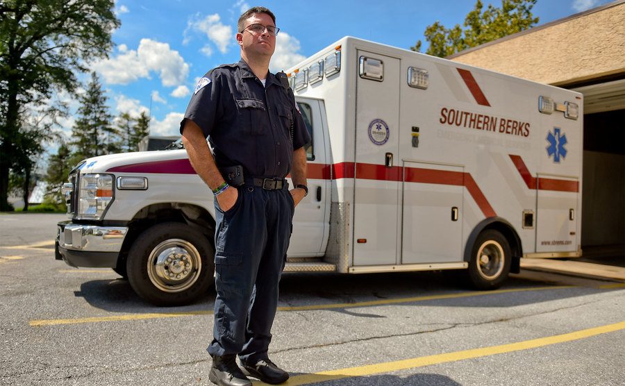 An Actual EMT, stands beside his rig with pride. 