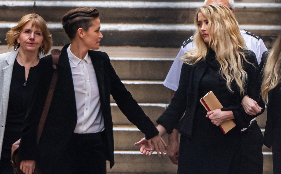 Amber Heard departs court with her girlfriend, Bianca.