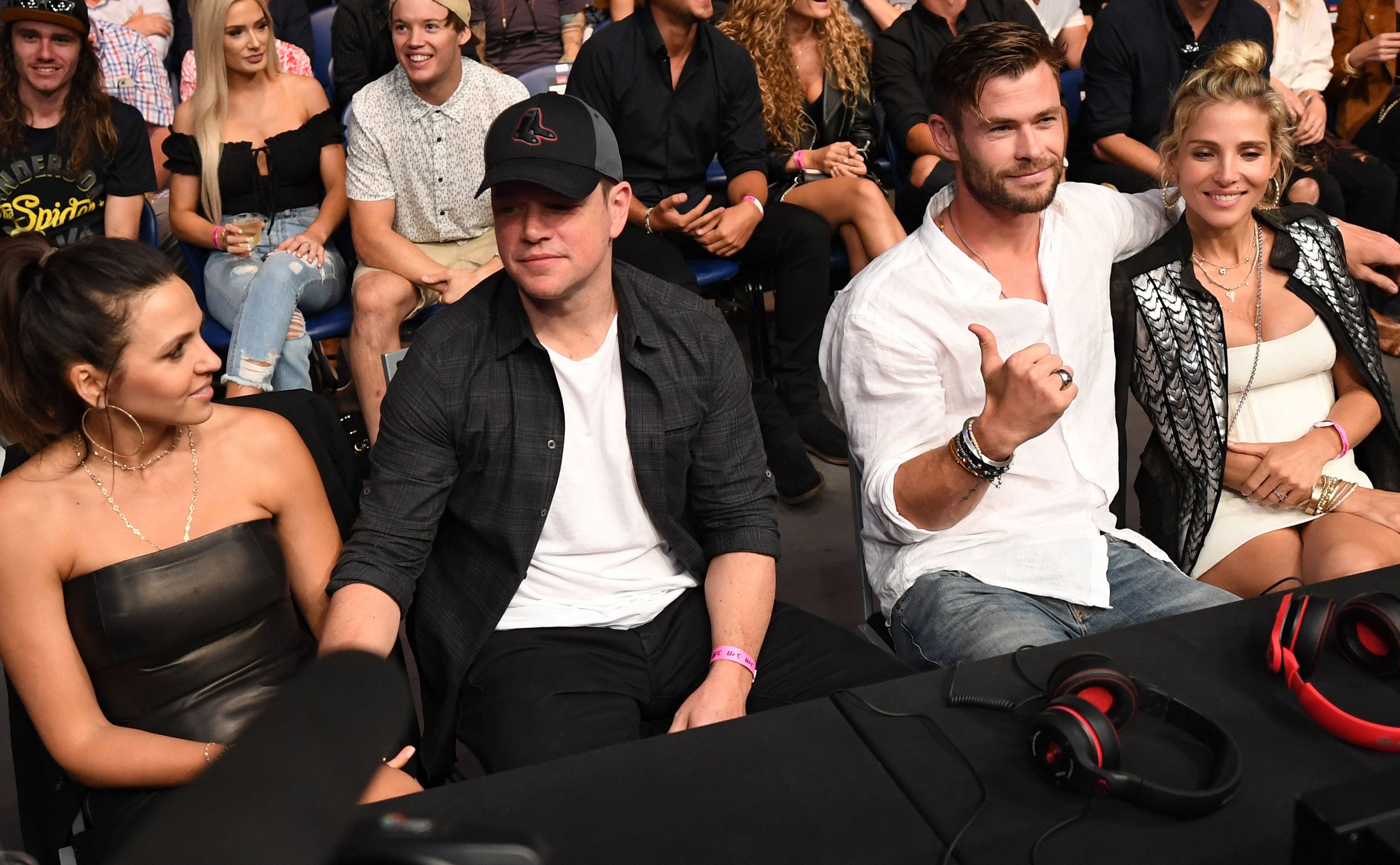 Matt Damon and Chris Hemsworth attend a game with their partners.