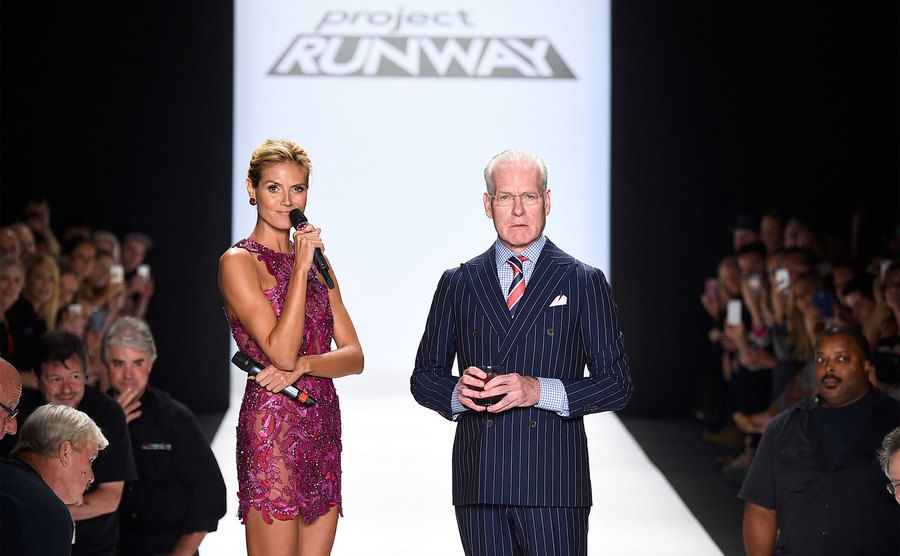 Heidi Klum and Tim Gunn walk the runway at the Project Runway fashion show. 